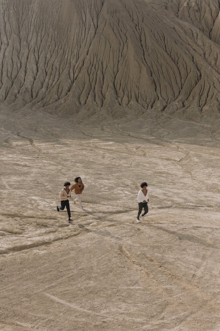 Friends Running On Desert