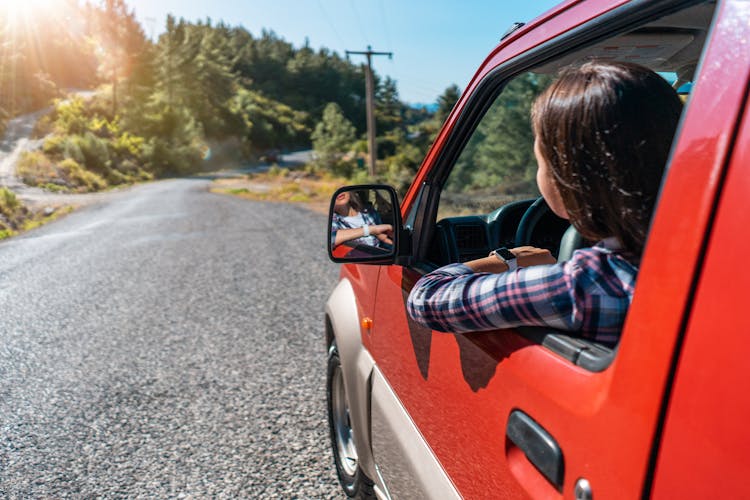 Anonymous Woman Driving Car On Road