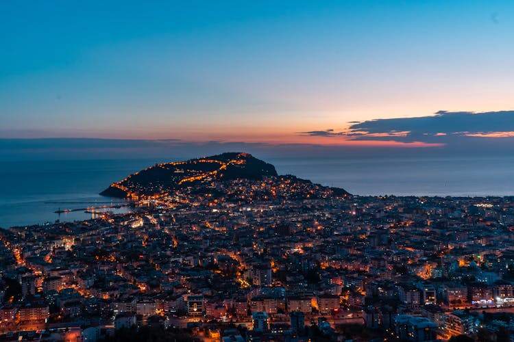 Glowing Coastal City At Sunset Time