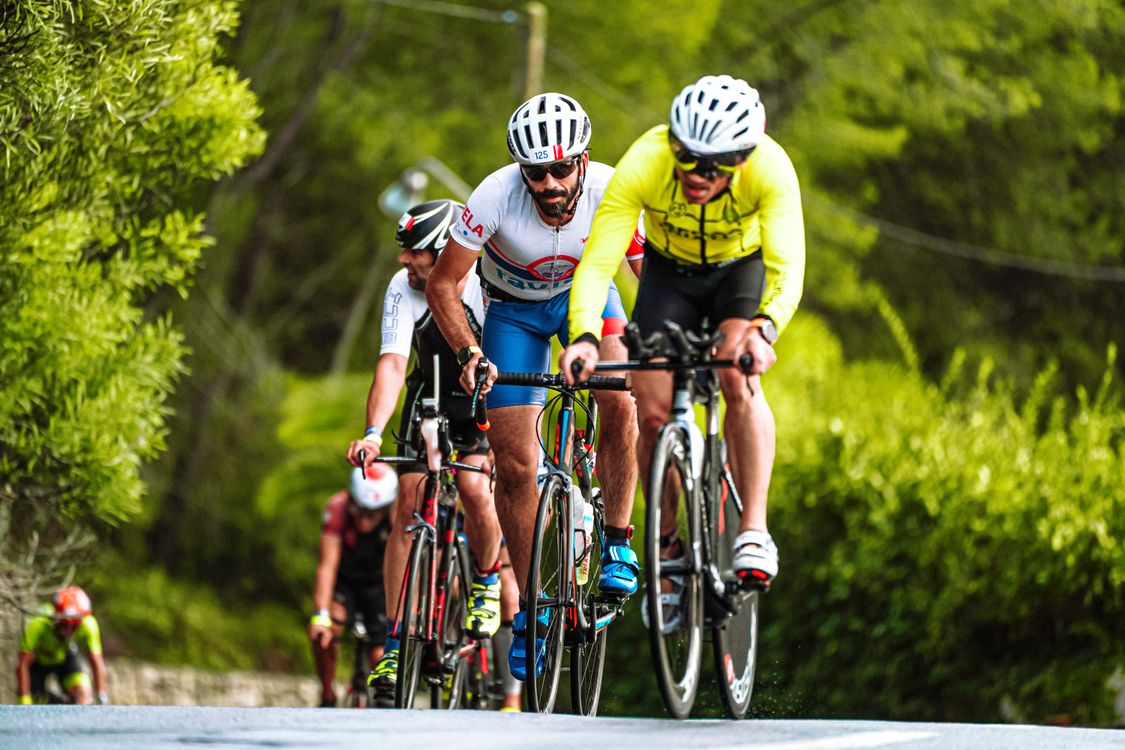 Competitive Bike Riders Men Competing in Bicycle Race · Free Stock Photo