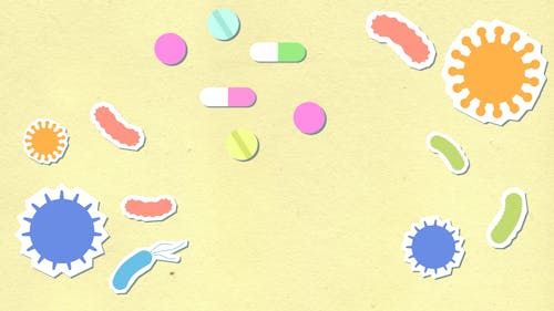 Paper cutout with viruses and pills