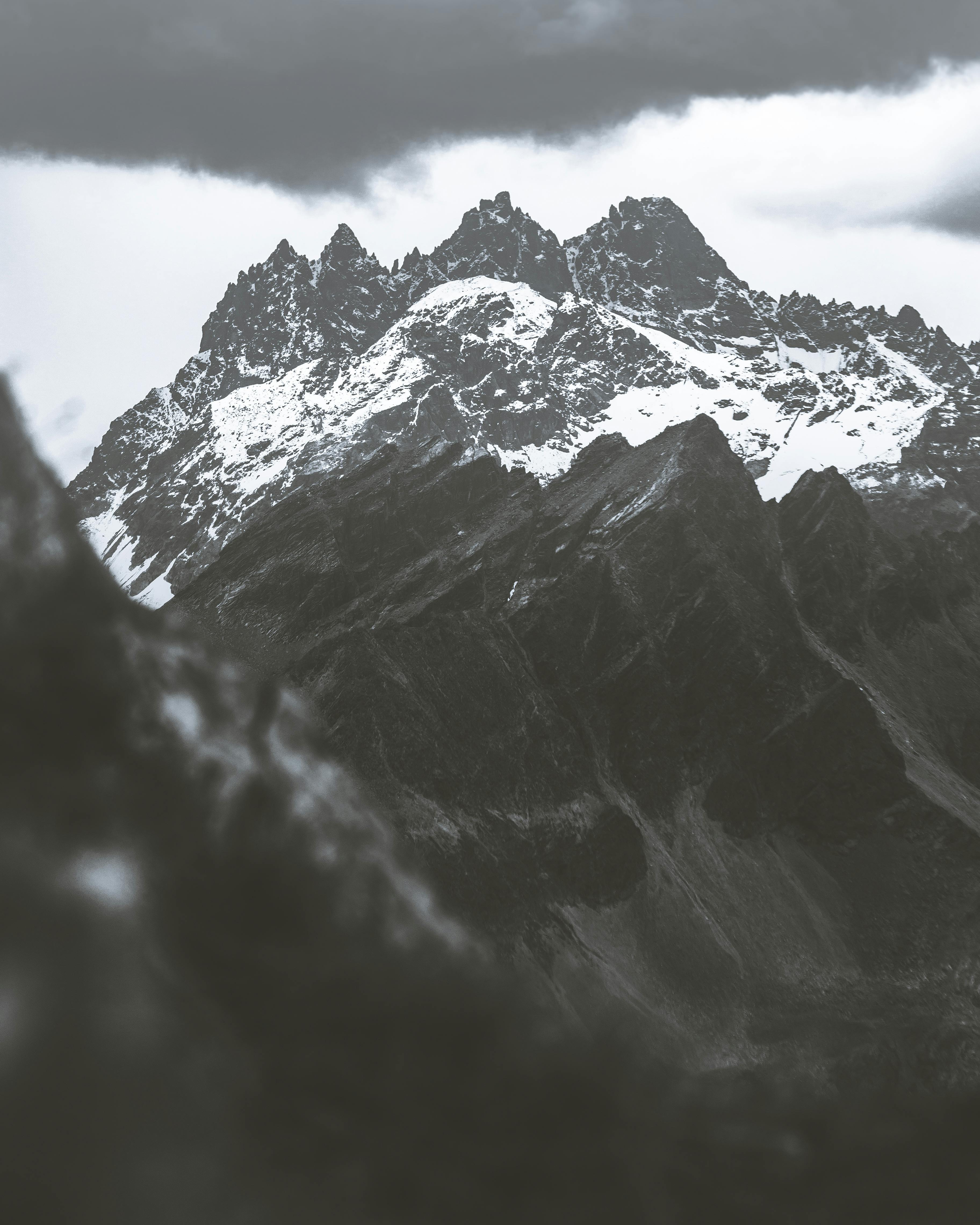Black and White Mountains Under White Sky ?? Free Stock Photo