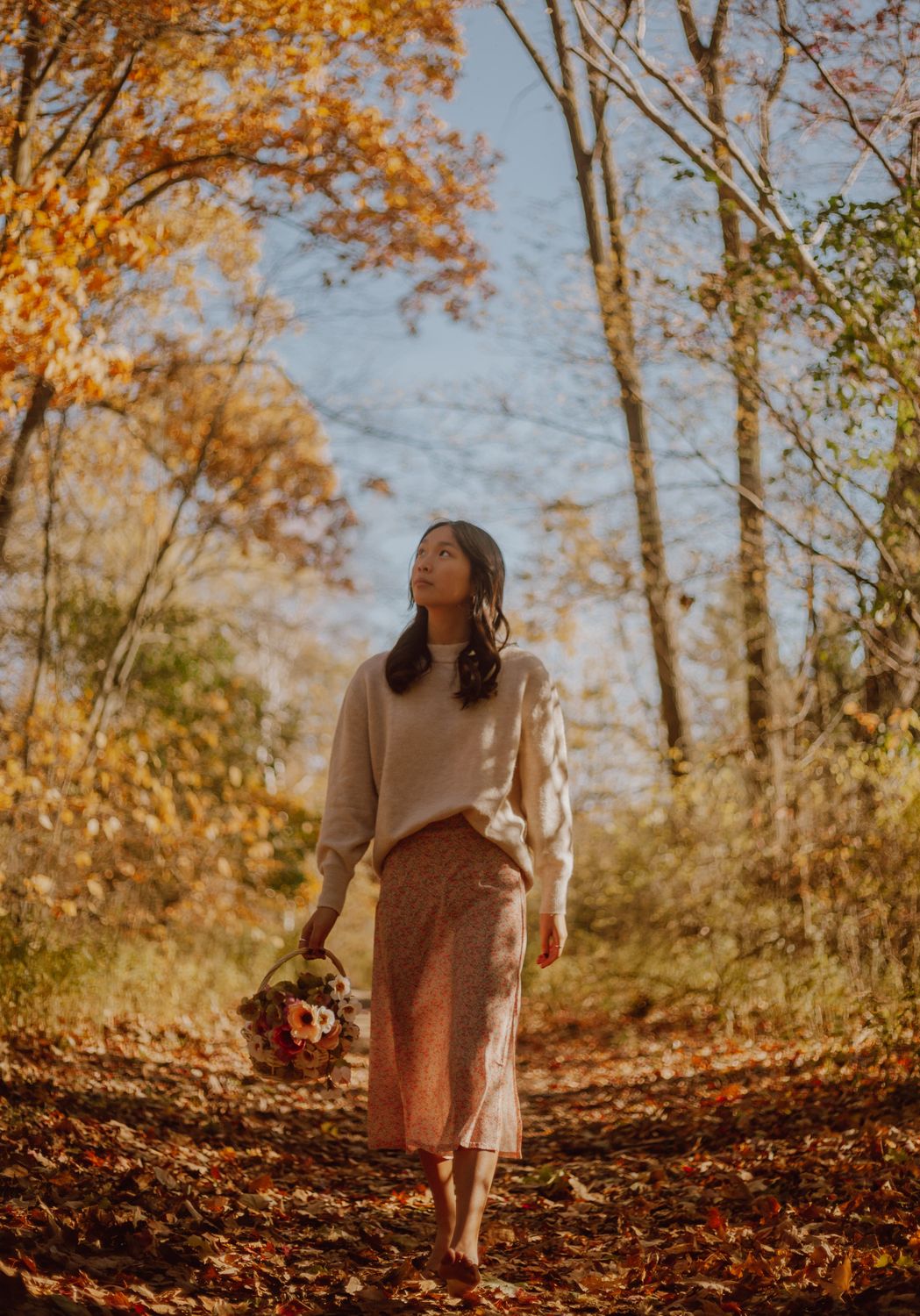 Dreamy Asian woman strolling in peaceful autumn forest · Free Stock Photo