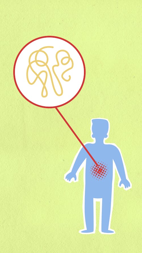 Cardboard illustration of sick human figure with genetic material in organism on green background