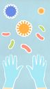 Cutout cardboard illustrations of human hands near assorted bacteria