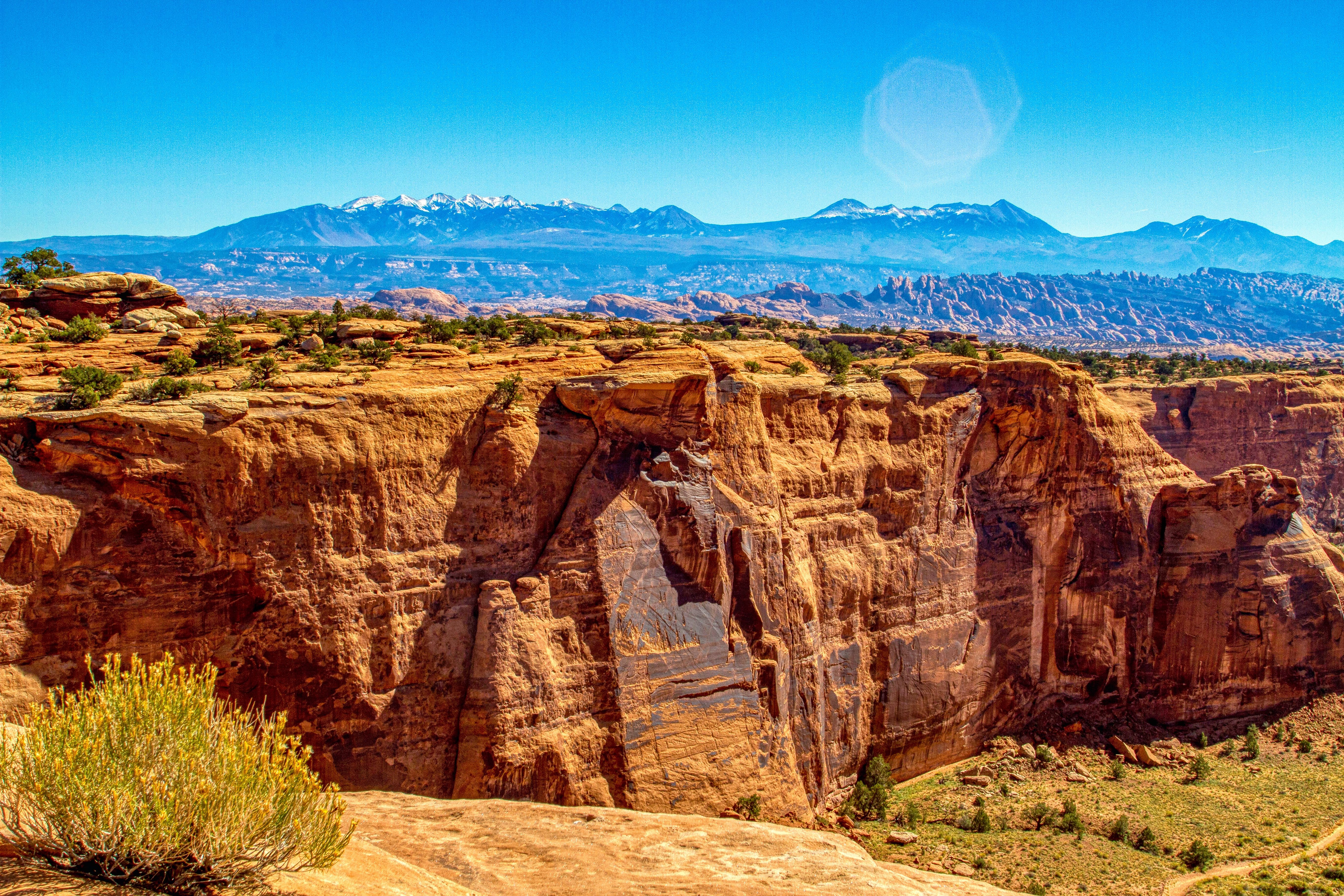 A Scenic View of Brown Rocky Mountain Under Blue Sky · Free Stock Photo