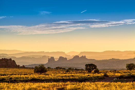 Capture the breathtaking sunrise over Moab's unique rock formations, showcasing nature's beauty.