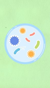 From above of decorative cardboard illustration of round shaped cell with bacilli and viruses on green background