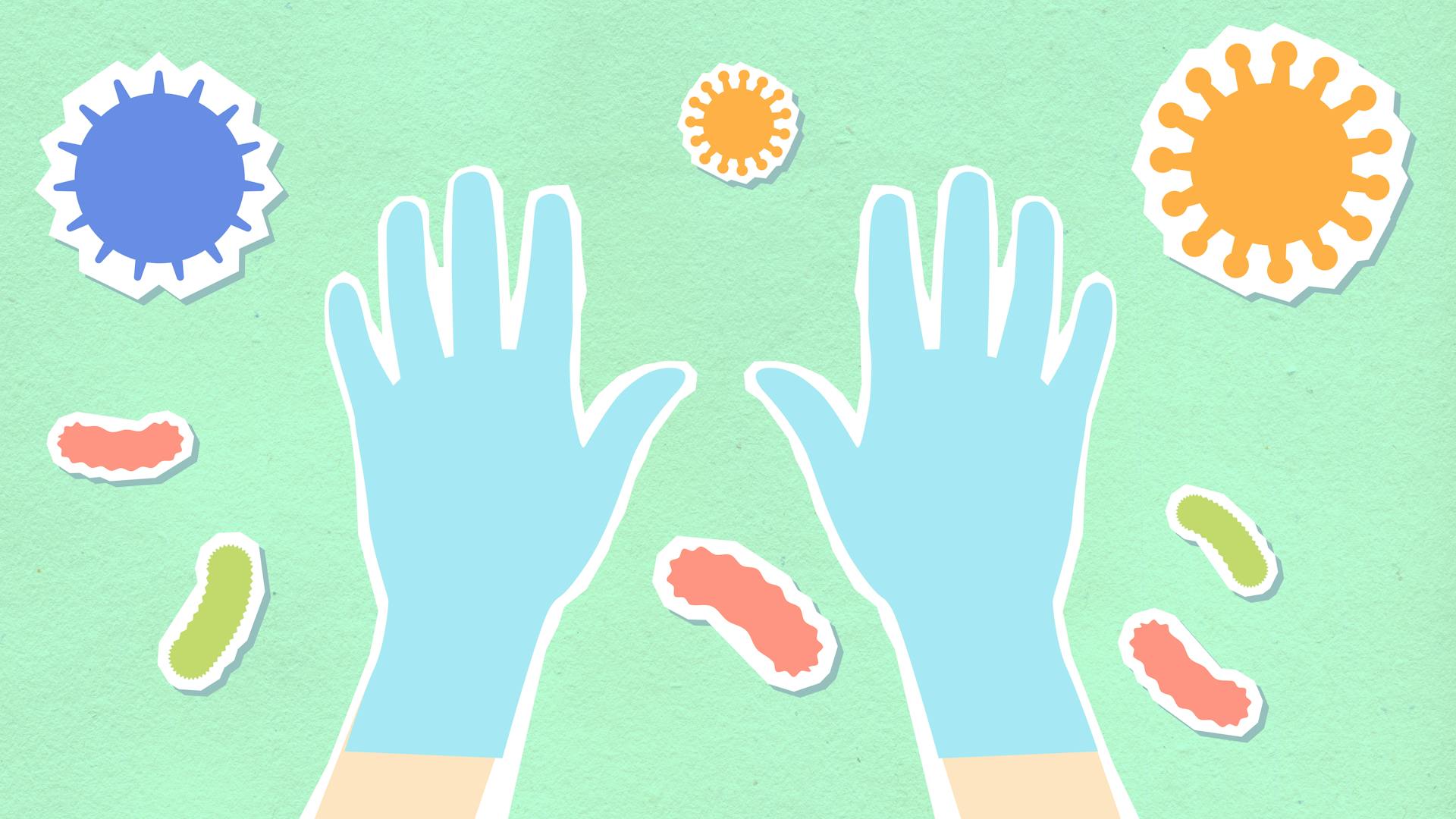 From above of decorative cardboard illustration of hands in sterile gloves among viruses and bacilli on green background