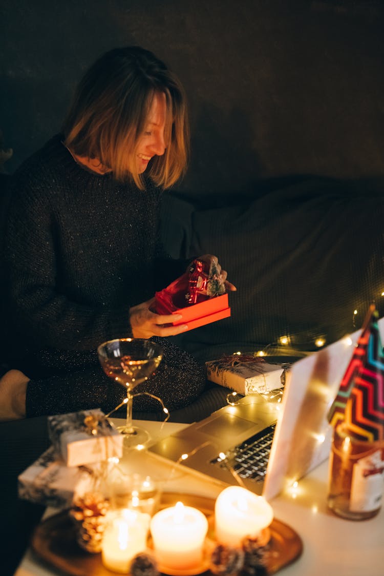 A Woman Opening A Present 