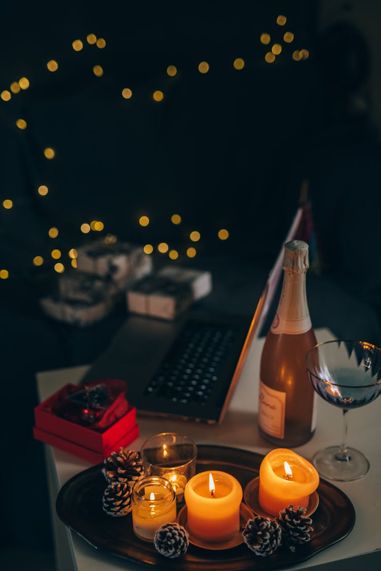 Pine Cones And Burning Candles On A Tray 