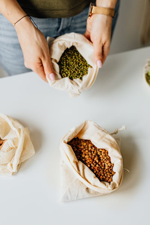 Hands Holding Bag of Beans · Free Stock Photo