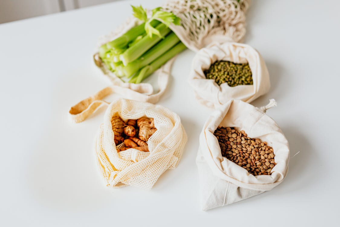 Bags of Food on a White Table · Free Stock Photo