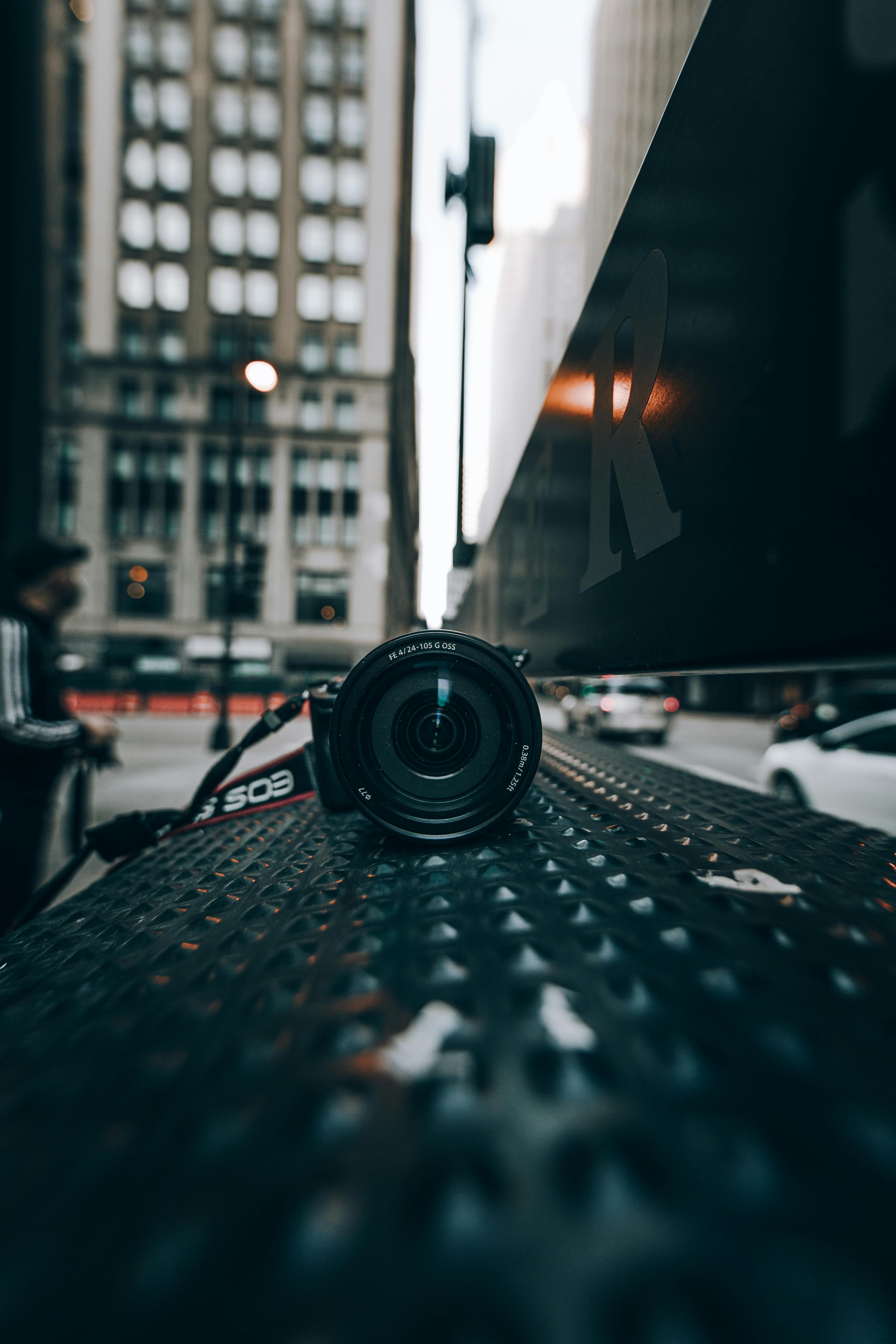 Free Close-up of DSLR camera on a city street in Chicago, capturing urban vibes. Stock Photo