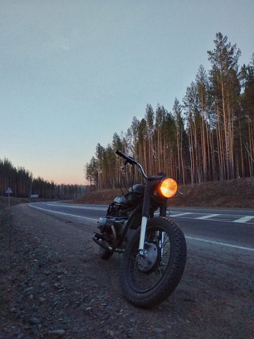 Black Motorcycle Parked on the Road