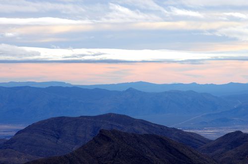 Free Peaceful mountain range with mist and clouds during sunrise, capturing nature's beauty. Stock Photo