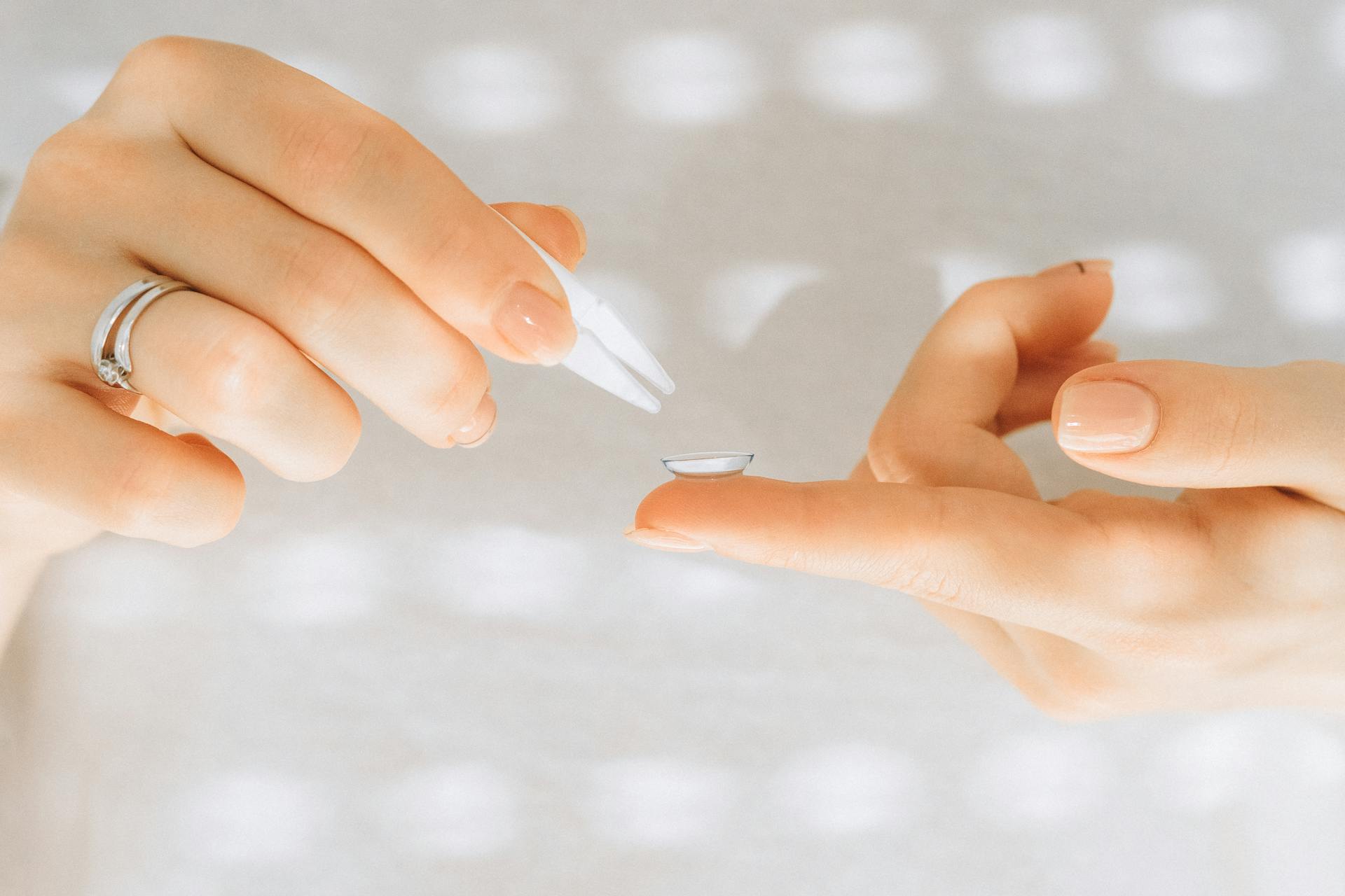 Person Holding a White Tweezer