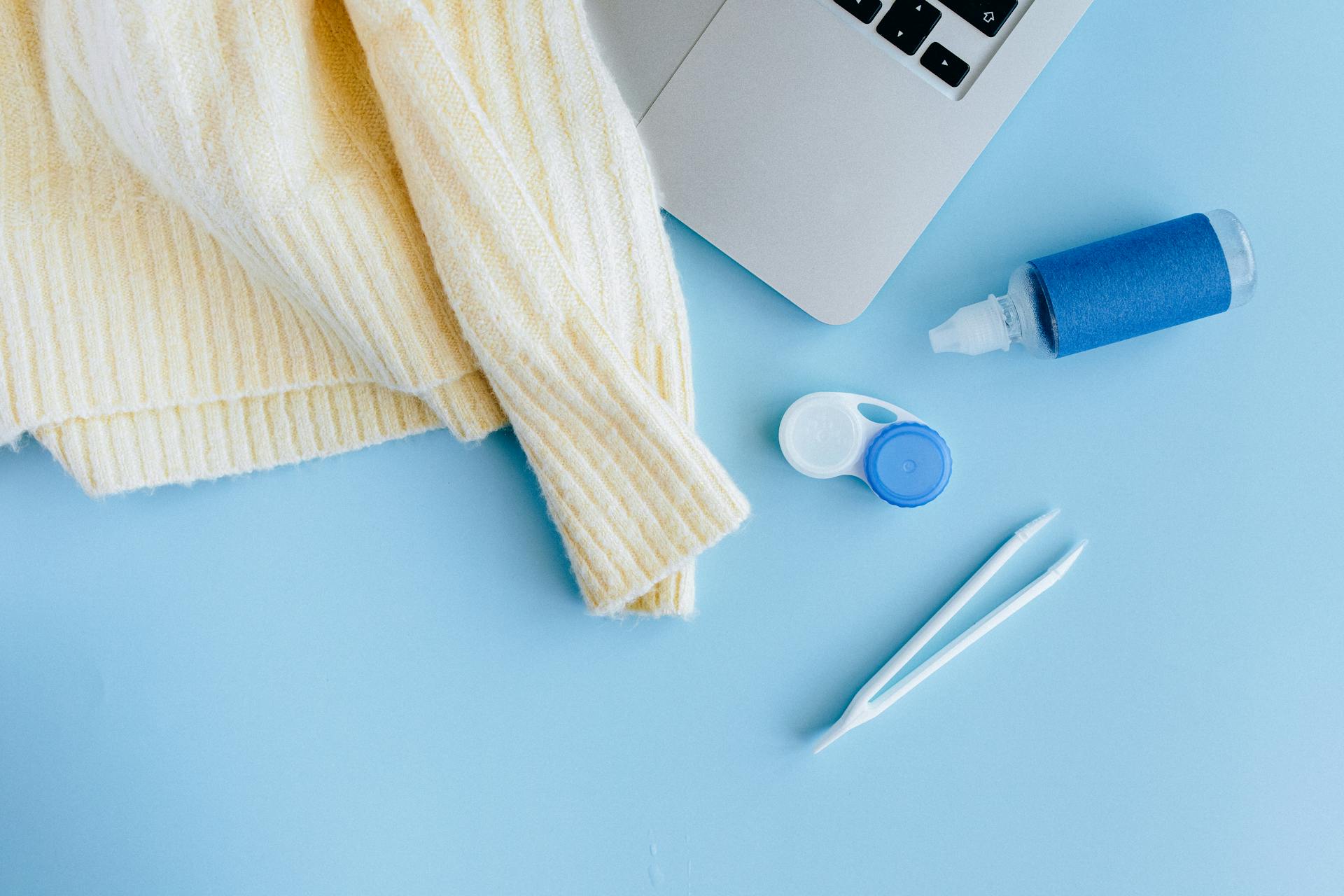 Close-Up Shot of Plastic Bottle beside a Tweezers