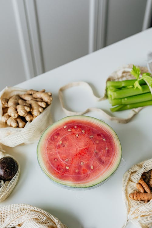 Sliced Watermelon Covered with Plastic Lid