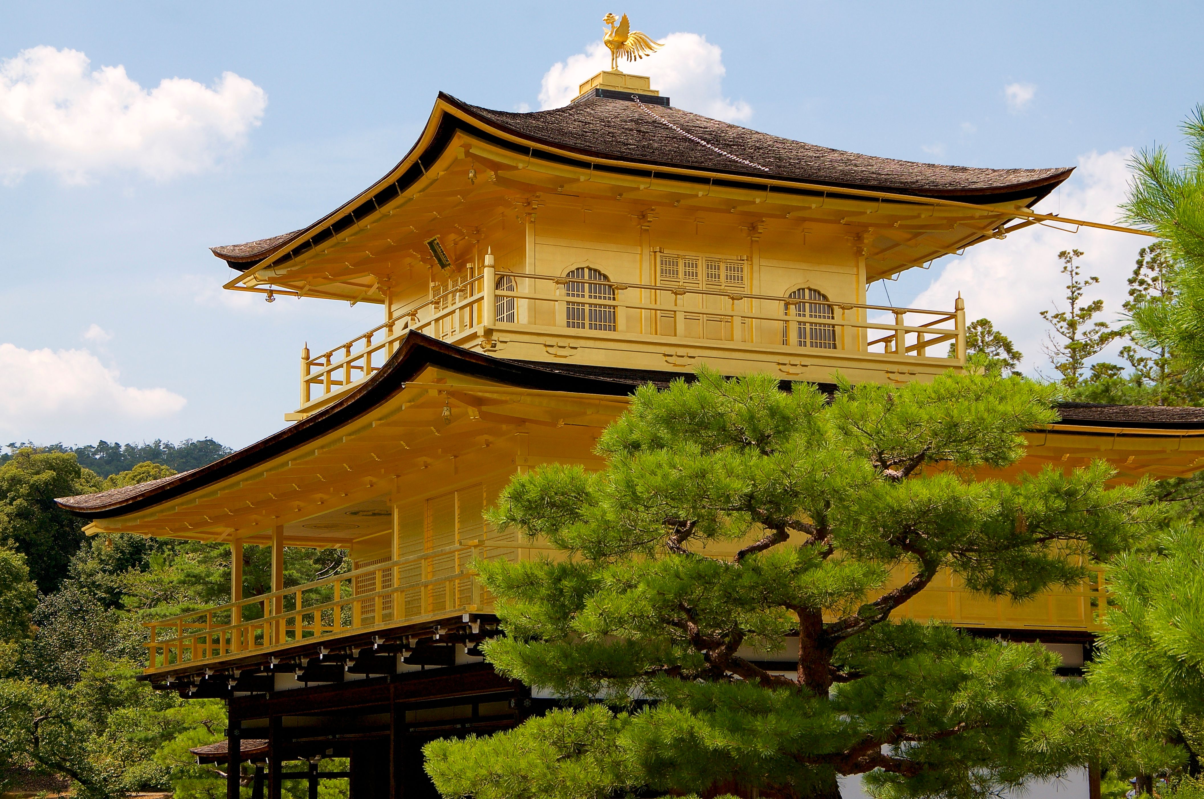 Capture of the iconic Kinkaku-ji, the Golden Pavilion, nestled in Kyoto's serene gardens. Capture of the iconic Kinkaku-ji, the Golden Pavilion, nestled in Kyoto's serene gardens.