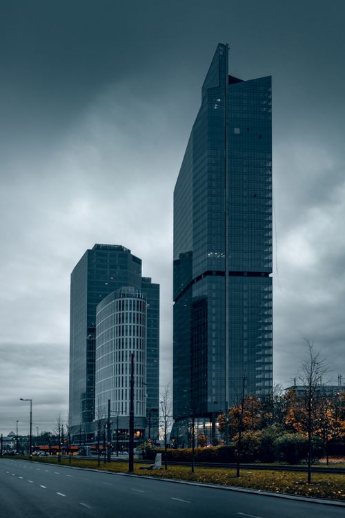 Free Dramatic view of Warsaw's modern skyscrapers under a gloomy sky. Stock Photo
