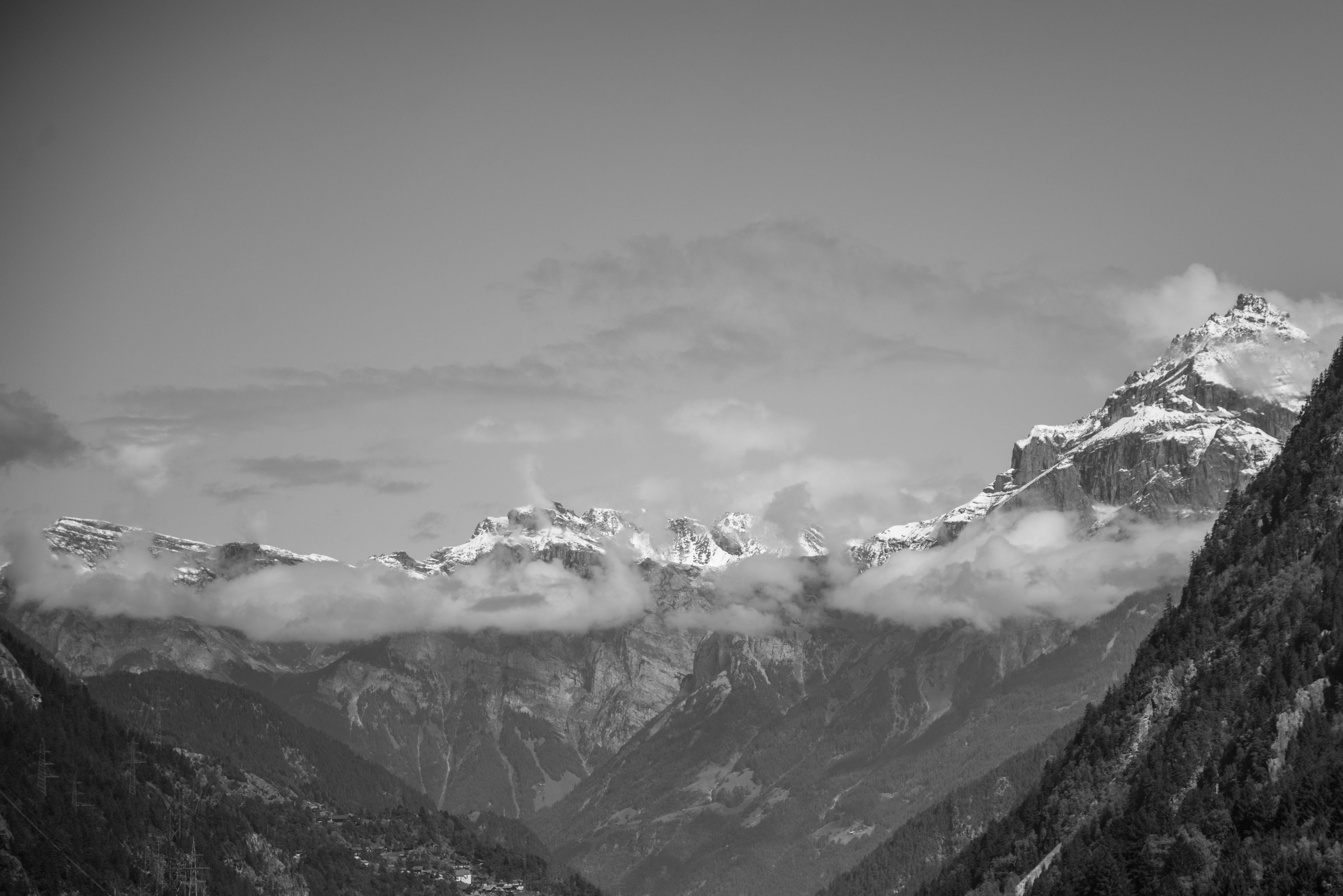 Snow Covered Rugged Mountain With Mist Photograph