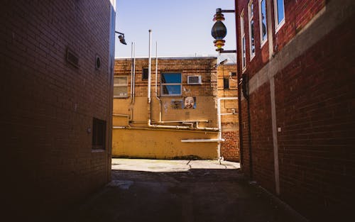 Základová fotografie zdarma na téma cihlová budova, cihlová zeď, denní světlo
