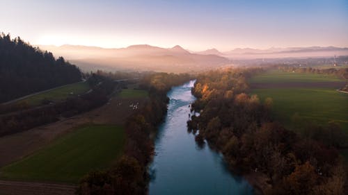 Free Mist Above Landscape With Fields and a River  Stock Photo