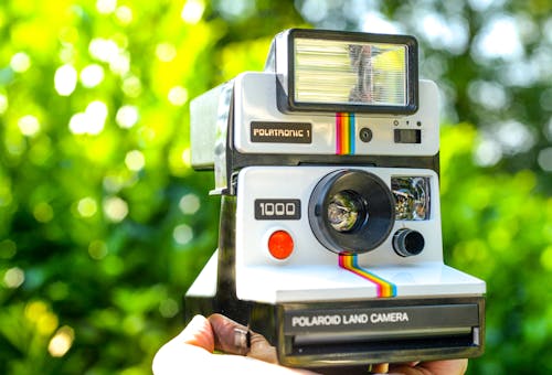 White and Black Polaroid 1000 Land Camera