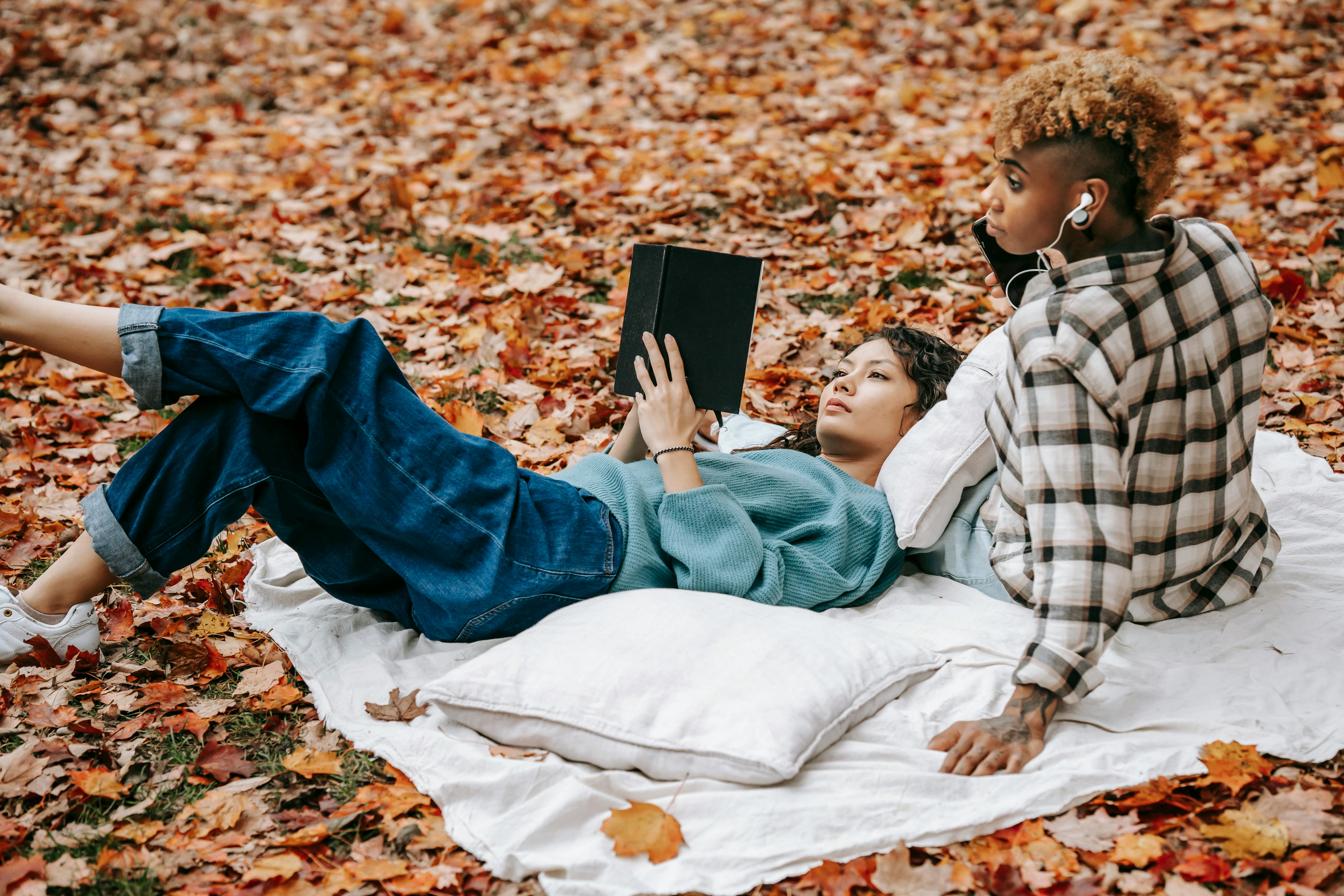 multiracial loved women resting in park