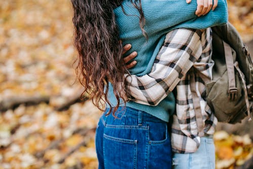 Crop couple embracing in nature