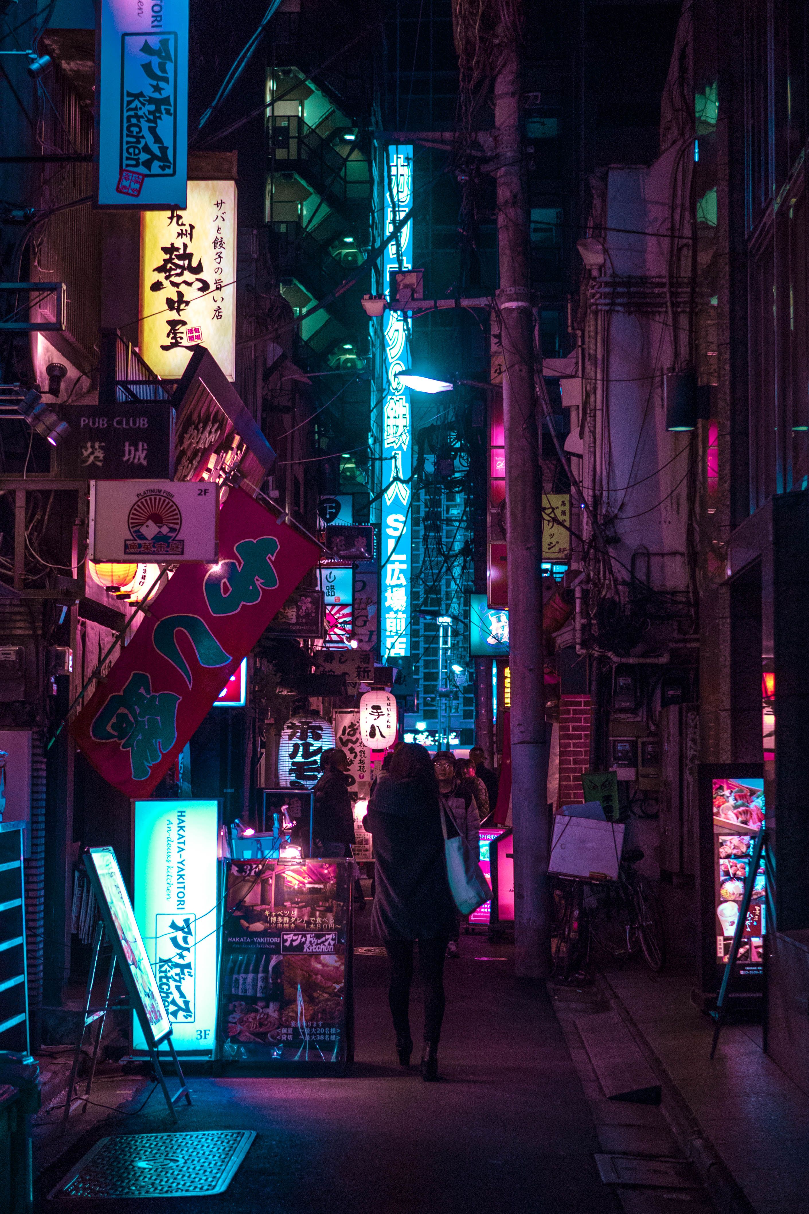 Explore the vibrant neon-lit streets of Tokyo at night, capturing the city's lively atmosphere.. explore, vibrant, neon