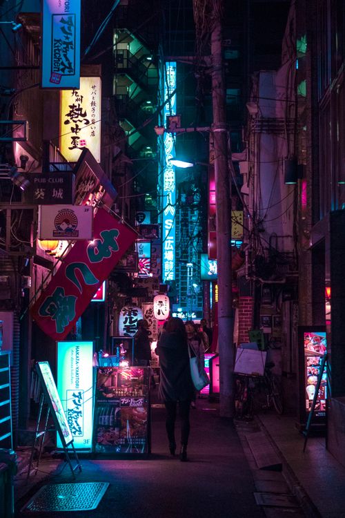 Free Explore the vibrant neon-lit streets of Tokyo at night, capturing the city's lively atmosphere. Stock Photo