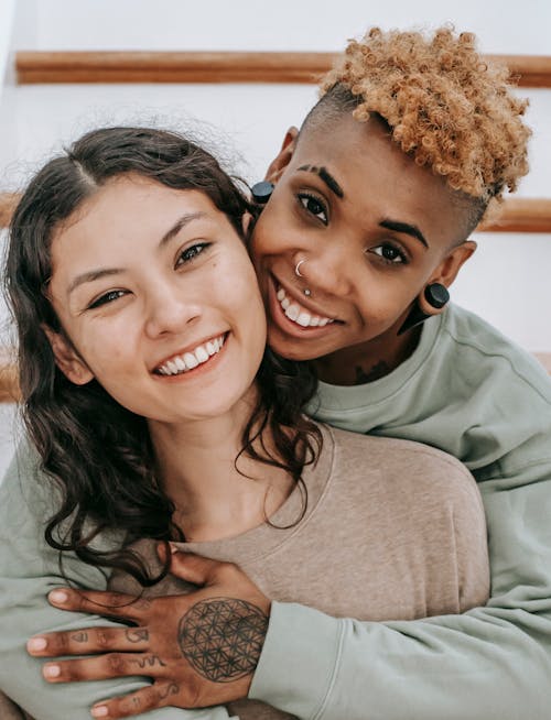 Free Happy multiethnic lesbians embracing each other Stock Photo