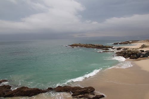 Foto profissional grátis de ao ar livre, areia da praia, beira-mar
