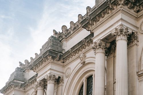 Free Exterior of aged stone building with classic architecture of facade with columns and ornamental elements Stock Photo