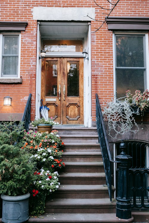 Staircase near building with potted flowers