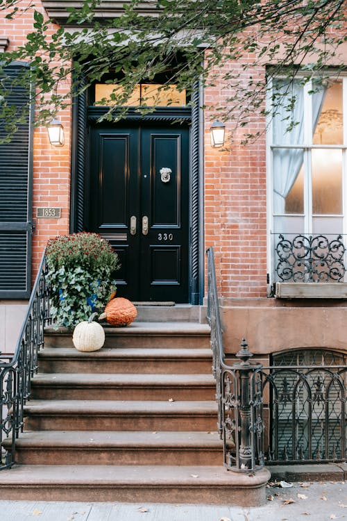 Entrance with pumpkins on stone stairs