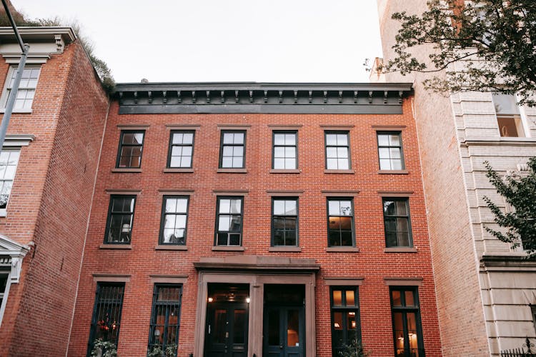 Facade Of Brick House With Black Window Frames