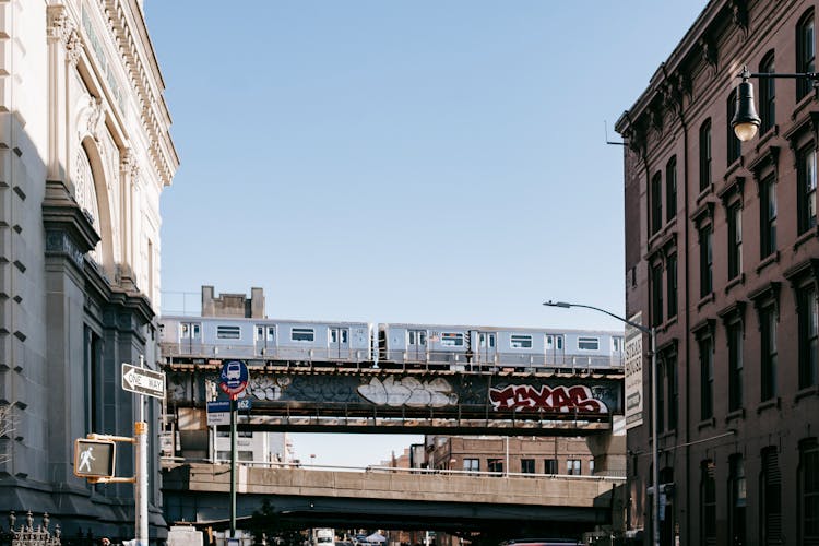 Train Driving On Railroad On Bridge Over Street