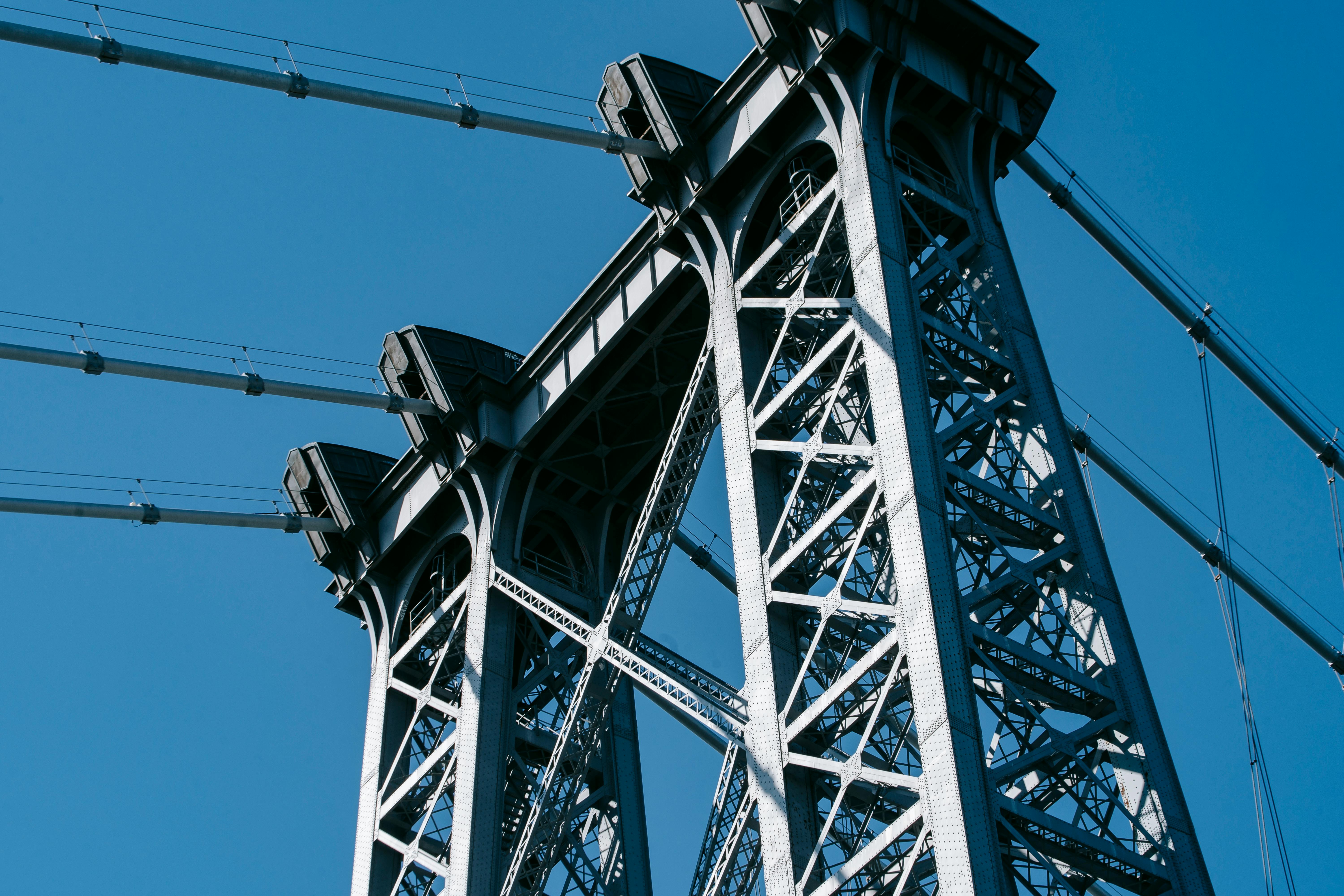 cable metal construction of bridge against blue sky