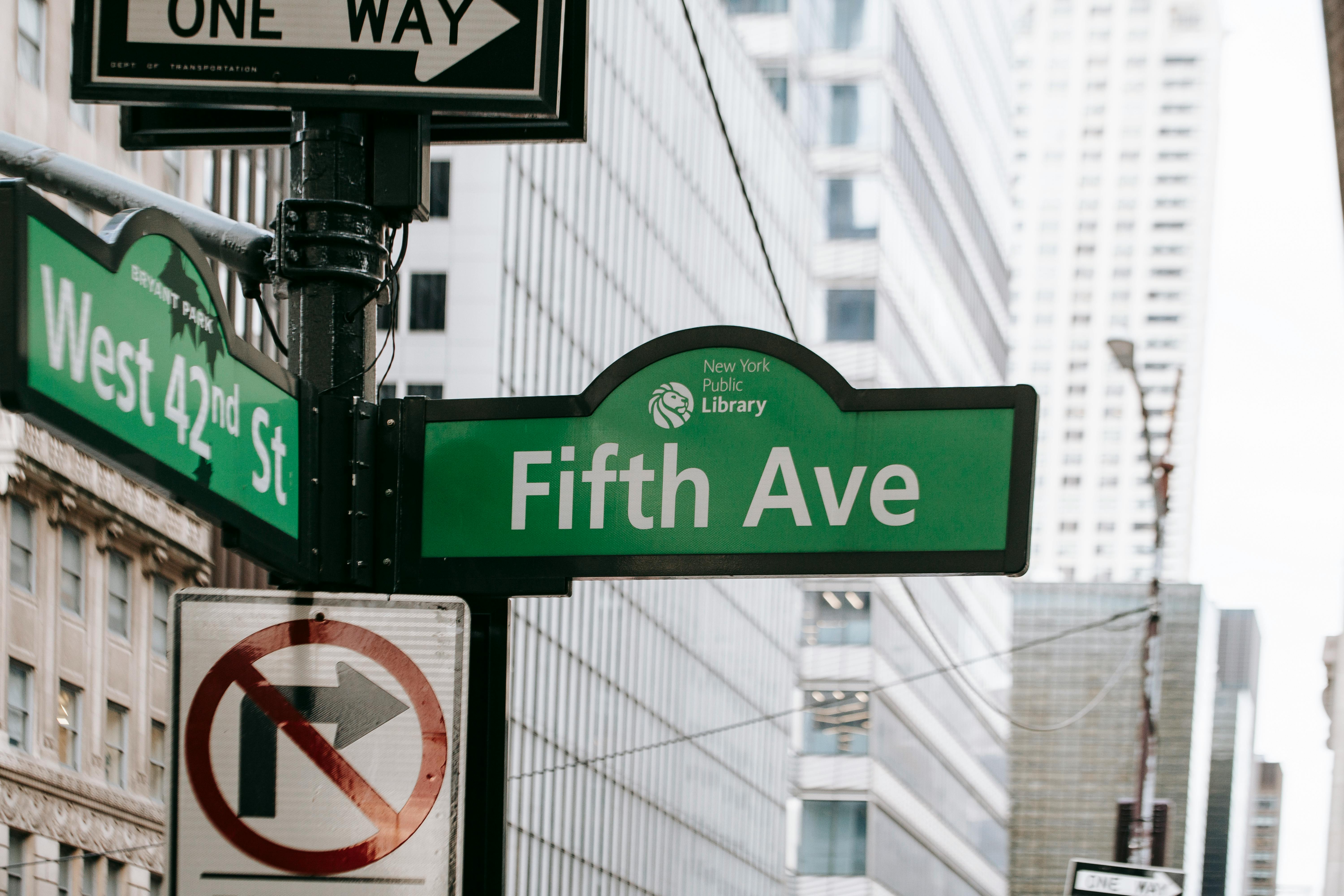 sign showing direction on city street