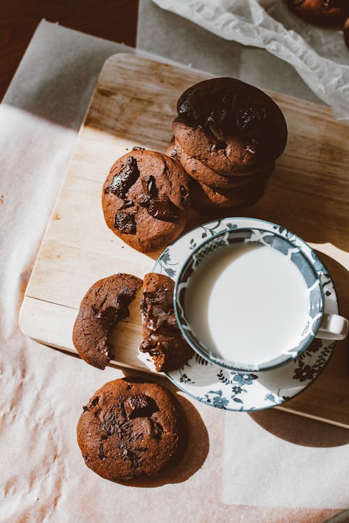 Free Chocolate Cookies and a Cup of Milk  Stock Photo