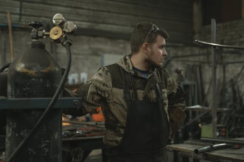 A Man inside a Metal Shop