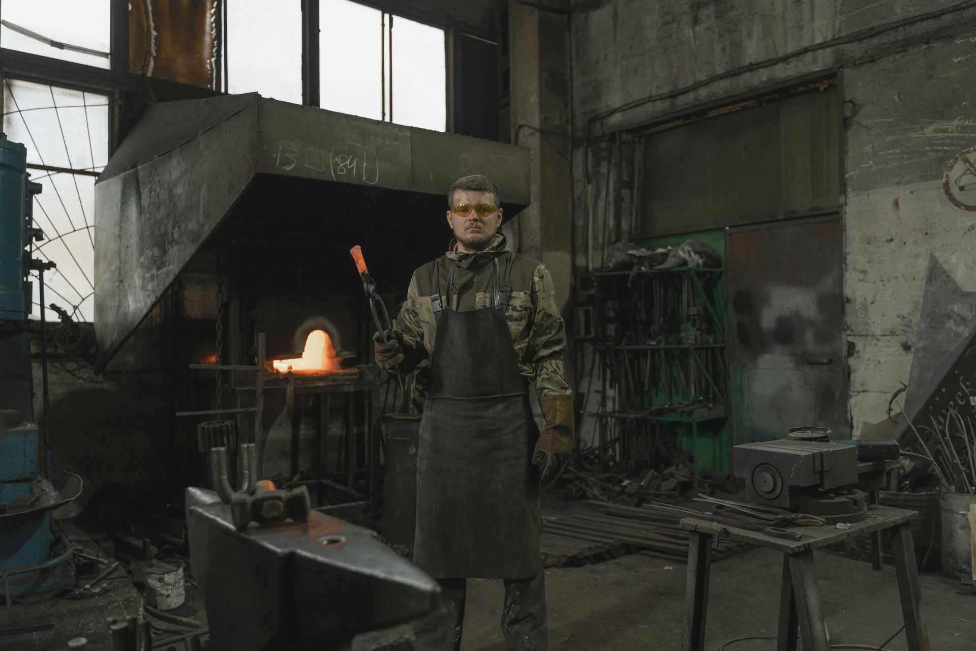 A Blacksmith Standing in a Forge