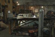 Gray Metal Tank Near Brown Wooden Table