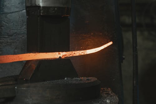 Hot Metal Being Formed in a Machine