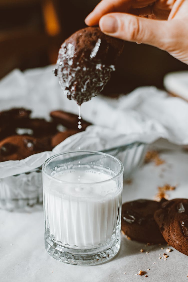 Close Up Of A Cookie And A Glass Of Milk