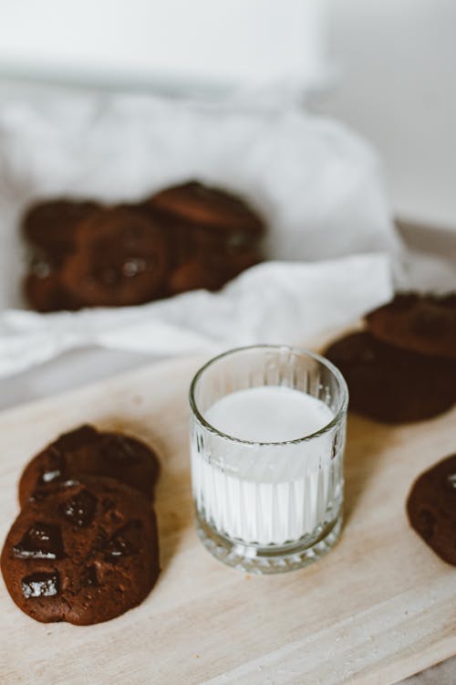 Free Chocolate Cookies and a Glass of Milk Stock Photo