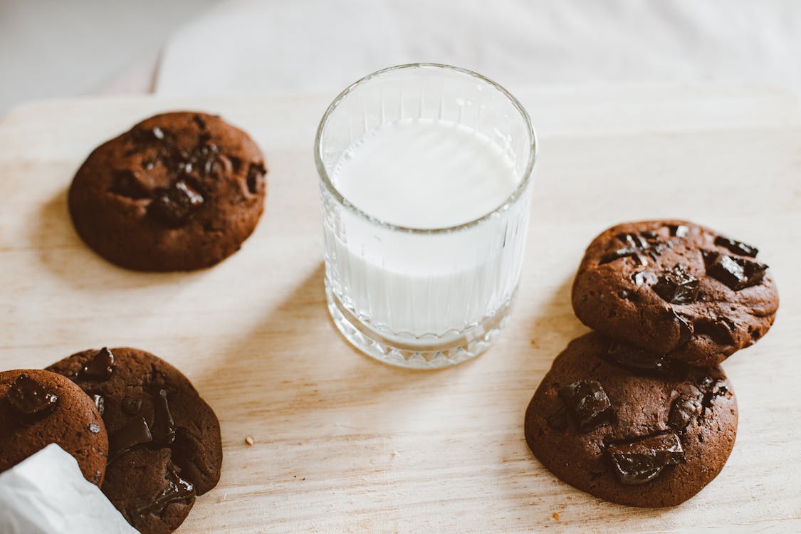 Free Chocolate Cookies and a Glass of Milk  Stock Photo